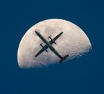 AN AIRPLANE CROSSES THE MOON.jpg